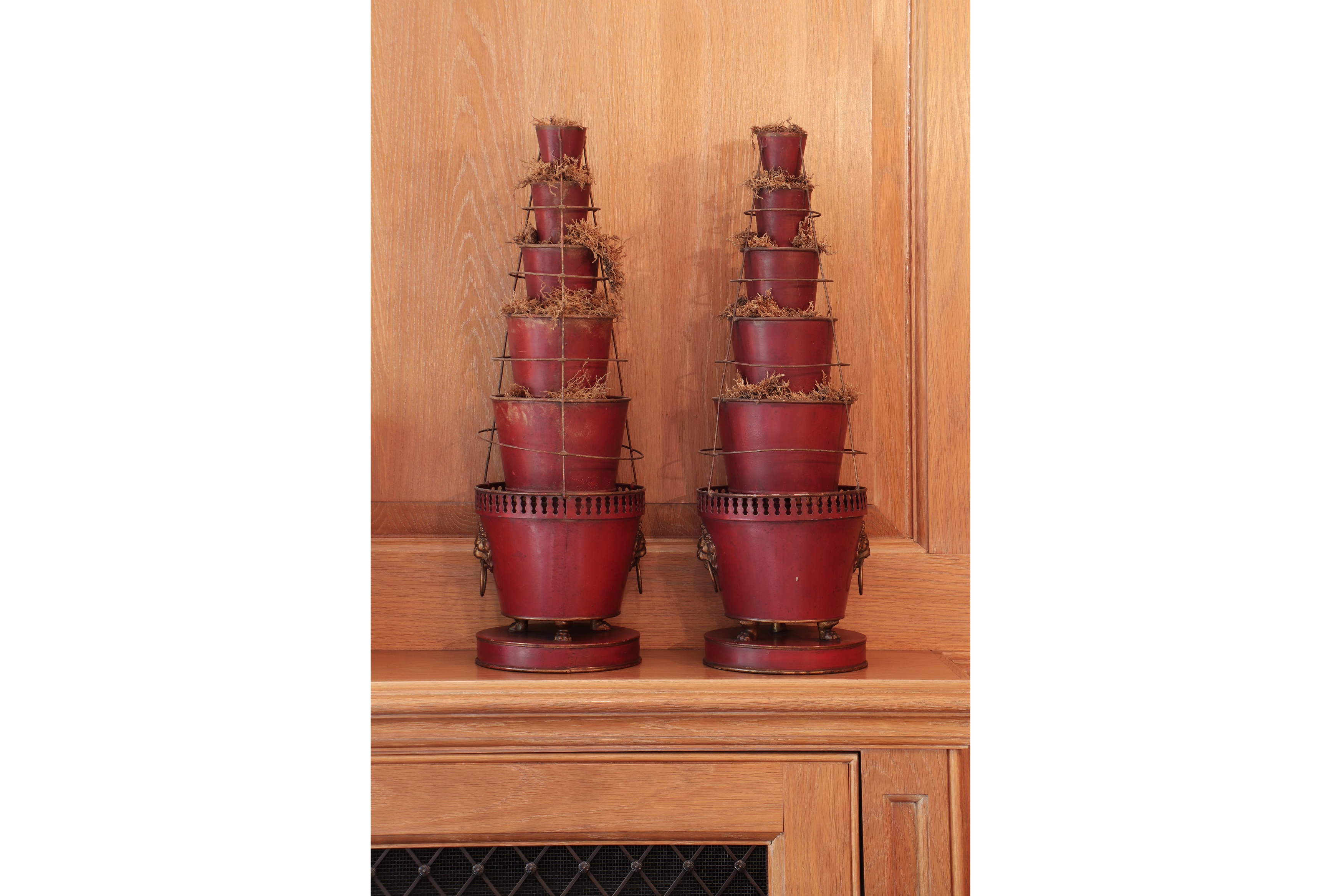 A pair of red-painted toleware graduated vases
